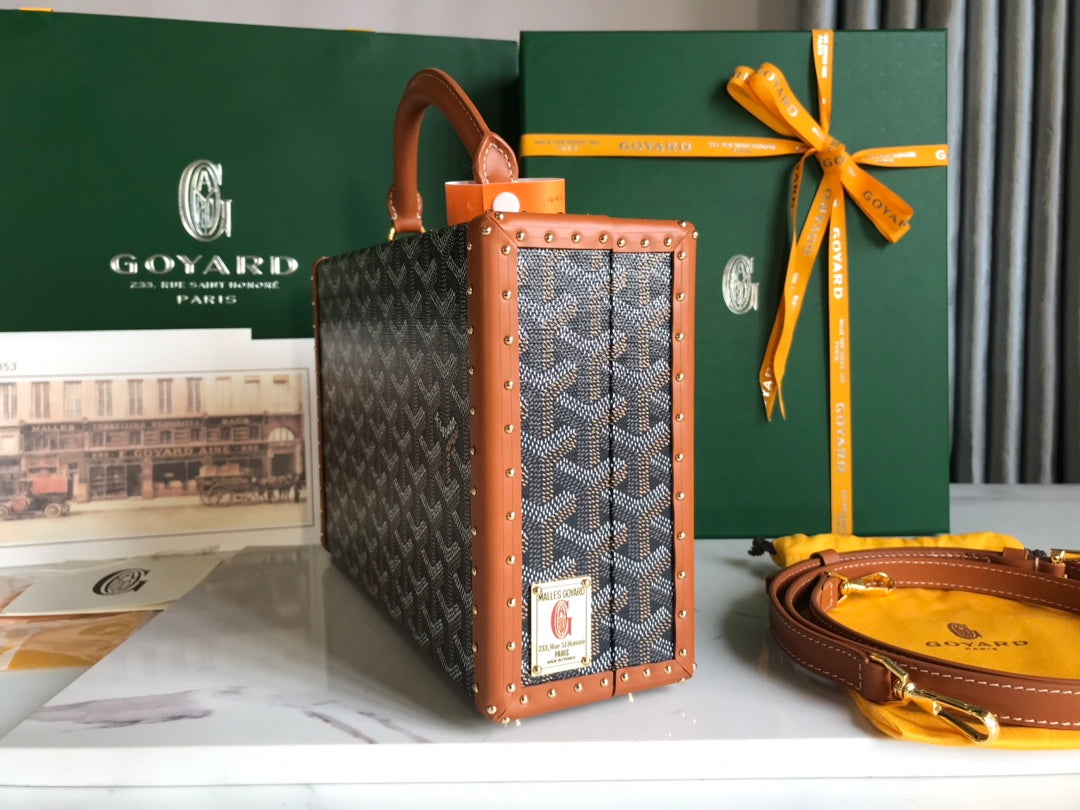GRAND HÔTEL TRUNK BAG 24 IN BLACK GOYARDINE CANVAS AND TAN CALFSKIN