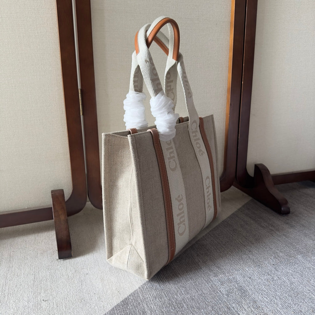 MEDIUM WOODY TOTE BAG 37 IN BEIGE LINEN CANVAS WEBBING LOGO EMBROIDERY BROWN CALFSKIN