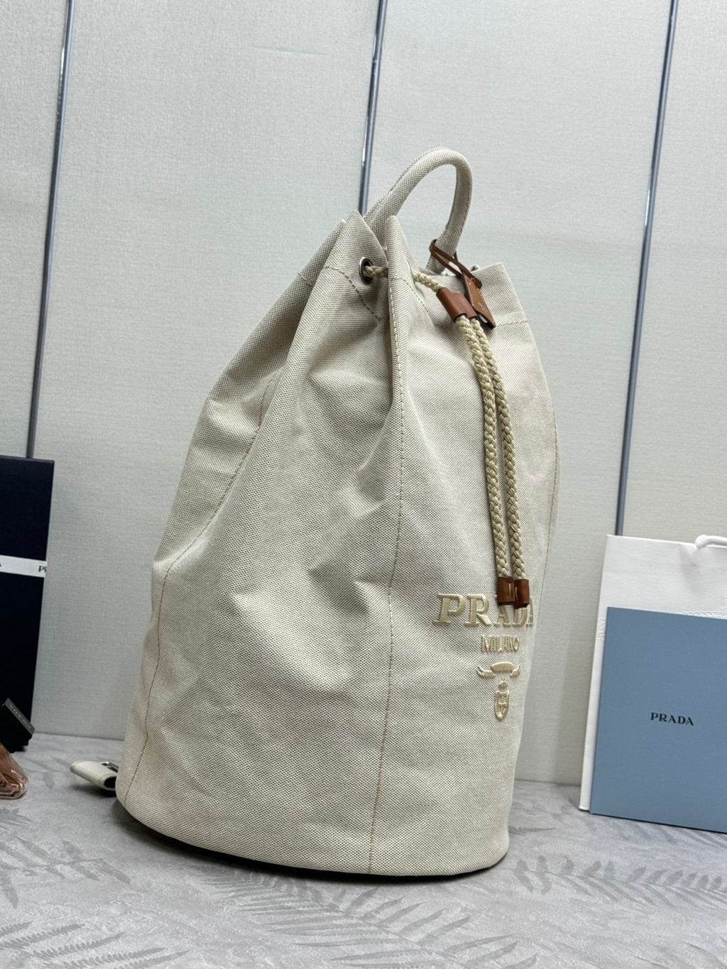 PRADA 25S DRAWSTRING BACKPACK 55 IN BEIGE CANVAS LINEN SILVER HARDWARE