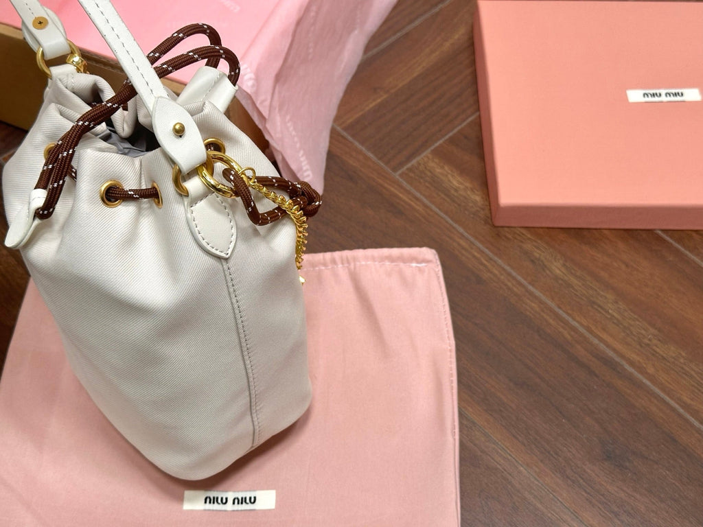 DRAWSTRING BUCKET BAG 21 IN WHITE CANVAS GOLD HARDWARE