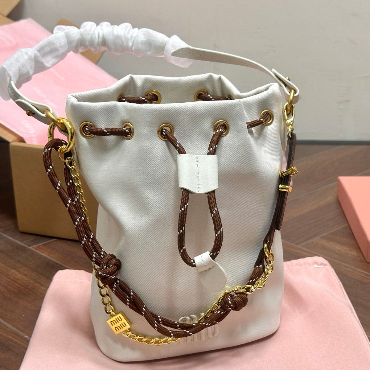 DRAWSTRING BUCKET BAG 21 IN WHITE CANVAS GOLD HARDWARE