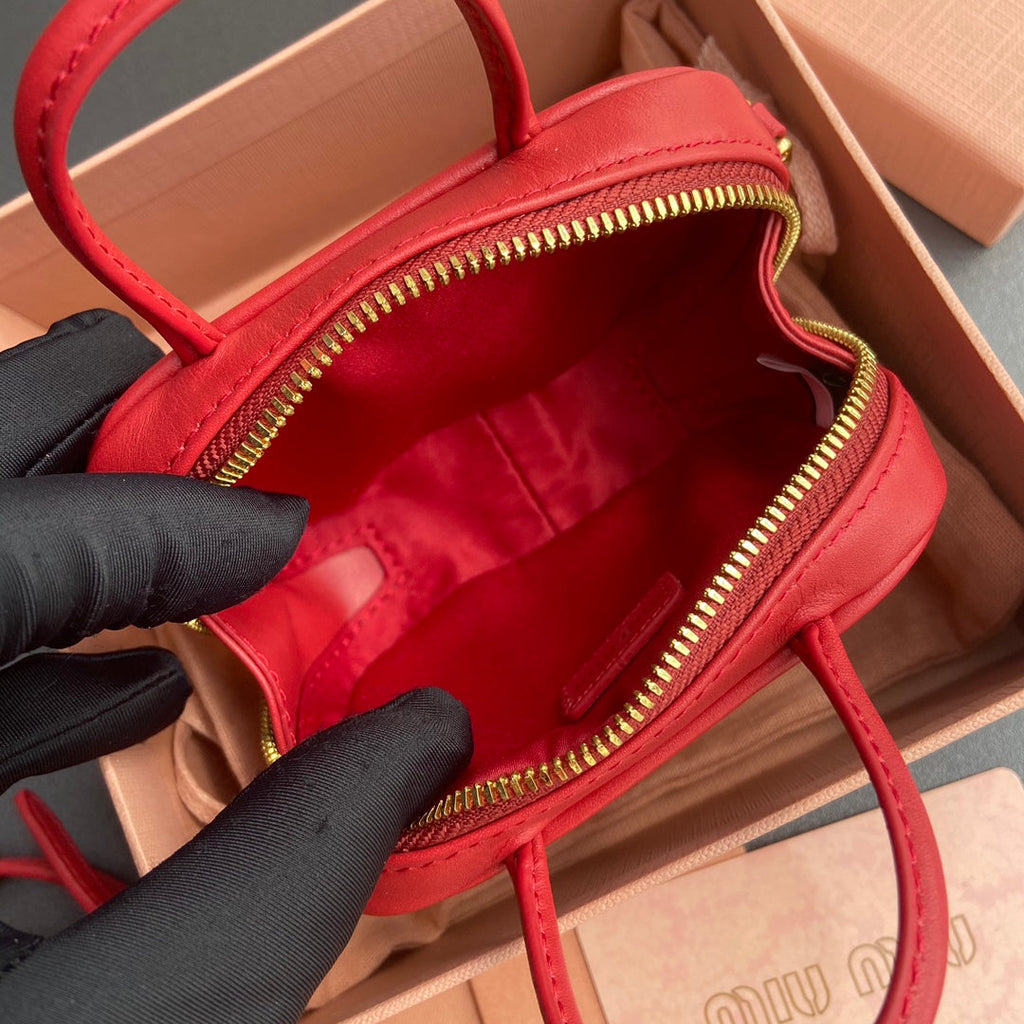 MICRO BAG KEYCHAIN 11 IN TALL POPPY RED CALFSKIN EMBOSSED LOGO