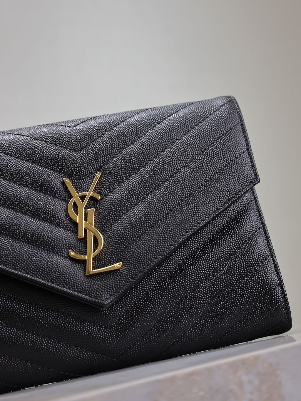 CASSANDRE CLUTCH 21 IN BLACK LAMBSKIN GOLD HARDWARE